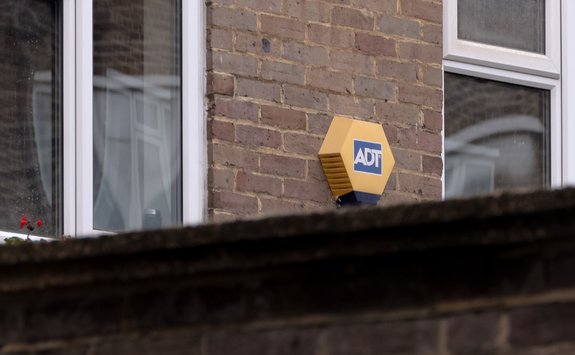 A house security alarm on the outside of the house	